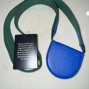 Loewe Mini Heel Pouch Crossbody, Blue & Green with guitar strap.